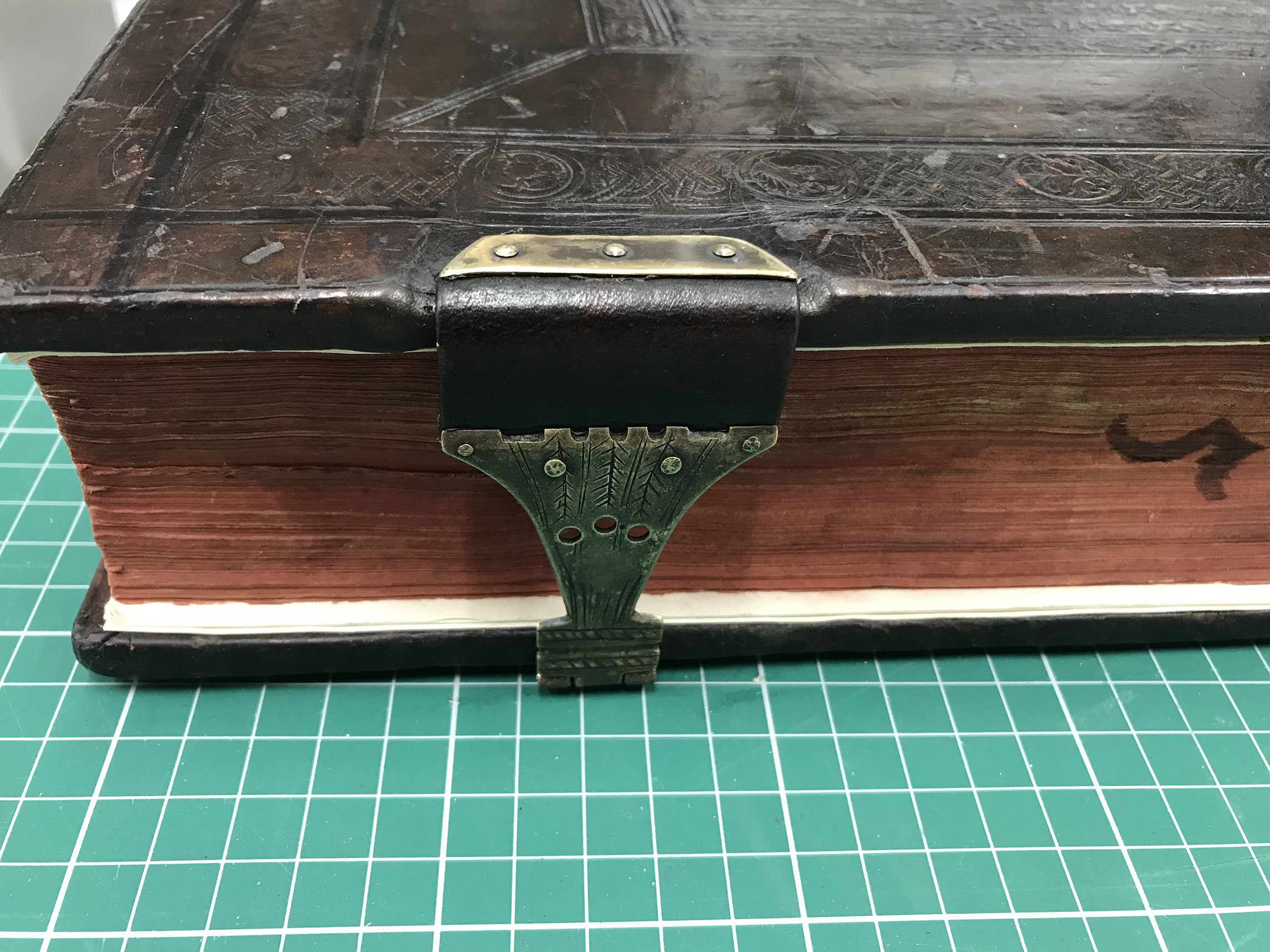  Clasp attached to binding 